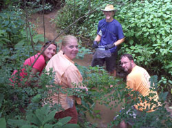 Melissa Niemi, Chandra Westafer, Jeff Eller and Shannon Sanders collect their first water samples in Shoal Creek, headwaters of the Altamaha River Watershed