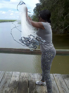 NOAA Intern Jasmine Richardson tosses her first cast net with the expertise and conviction of a pro