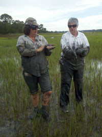 Stephanie Miles and Betty Bates earned their marsh mud mucker stripes