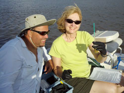 Rob Herrin and Sharon Butler test the heavier salt water collected  from the bottom aboard the pontoon boat in the Altamaha Delta