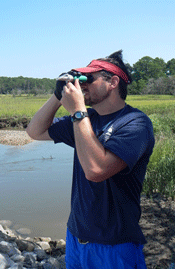 Ben Wells measures the salinity of a tidal creek using a refractometer