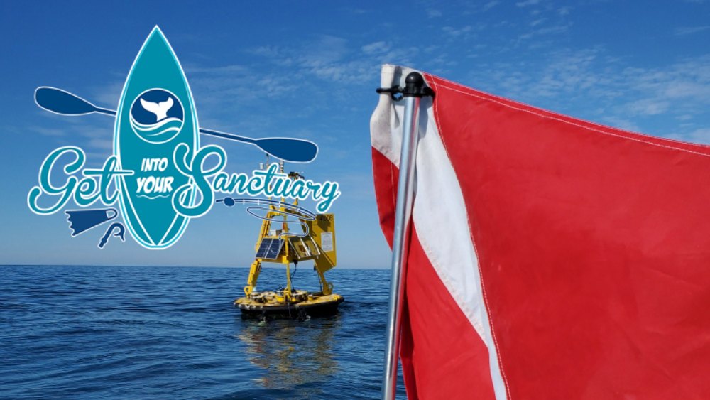 A red and white scuba diving flag is attached to a boat with a yellow weather buoy floating on the ocean surface.