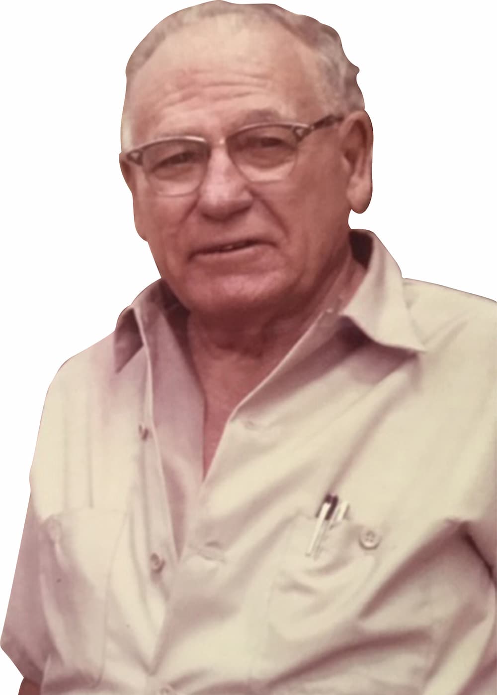 A person with white hair and glasses wearing a white button-up shirt.