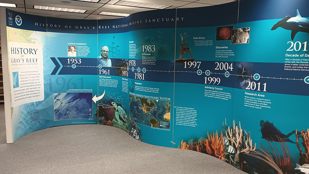 A curved exhibit with a history timeline of Gray's Reef National Marine Sanctuary