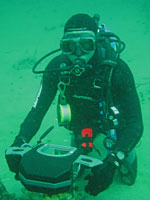 Randy using underwater acoustic rangefinder to locate tagged fishes