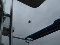 Candian Air Force C-130 Hercules makes a low pass over the R/V Joe Ferguson