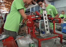 Team members make last-minute adjustments to their underwater robot during the MATE ROV Regional Competition. 