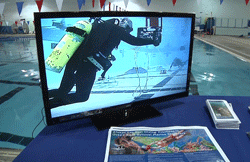 A video monitor provides a live feed of a Gray's Reef diver during underwater robotics competition. 