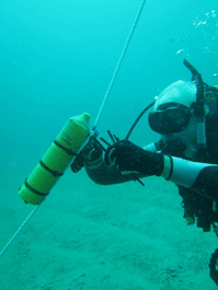 Author Richard LaPalme securing a receiver to a buoy line. 