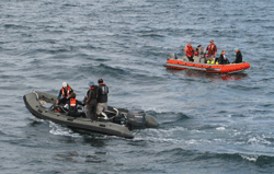 Small boats deployed from the ship take divers to dive sites.