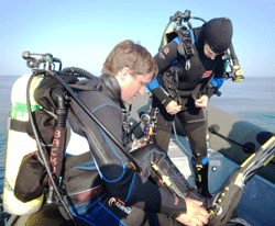 Divers Hampton Harbin (l) and Lauren Hesseman (r) prepare for a dive to conduct a visual survey in GRNMS.