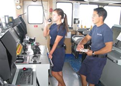 NOAA Corps officers ENS Felcia Drummond and ENS Rick de Triquet communicate with dive boats.