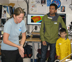 Senior Survey Technician Samantha Martin (l) explans the use of sonar during habitat mapping. 