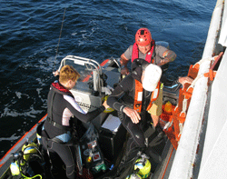 Science divers board small dive boats from the NOAA Ship Nancy Foster.